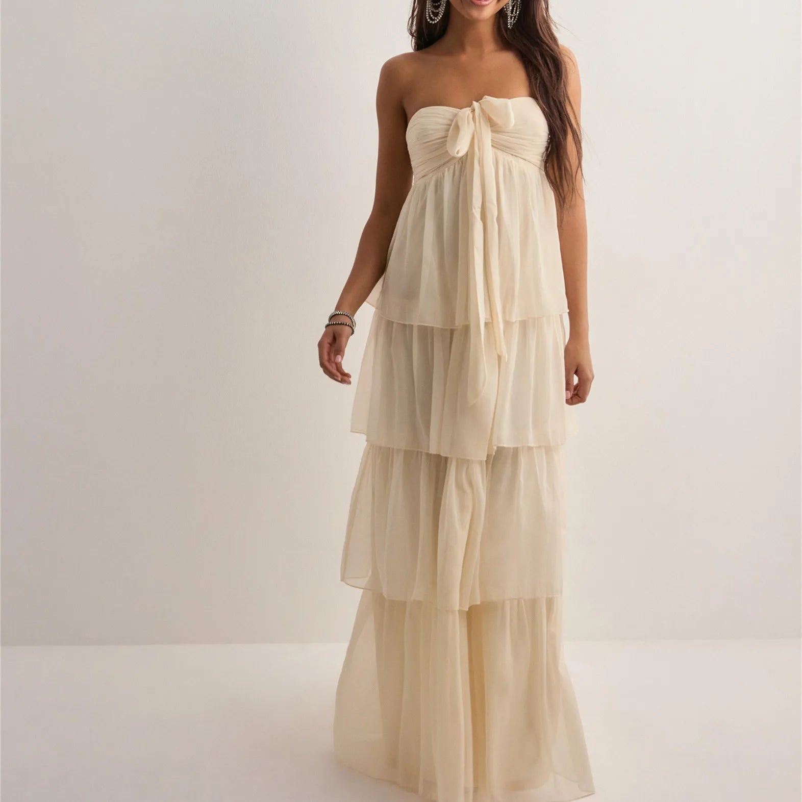 Hem and length detail of Jenny strapless tiered dress being worn