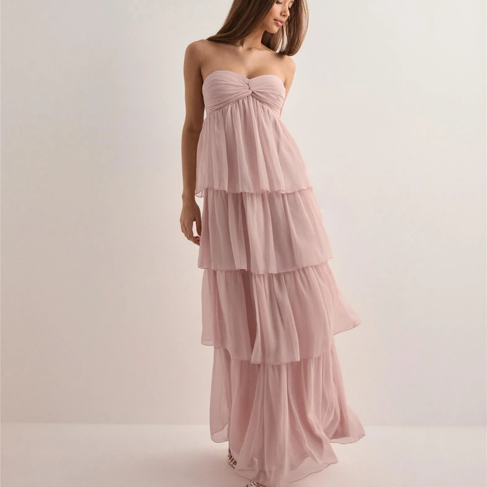 Woman in Jenny strapless tiered dress showing movement and flow