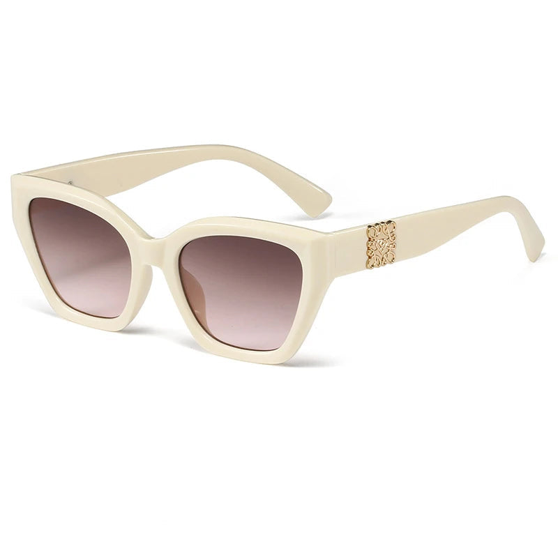 Beige sunglasses with gradient lenses on a white background