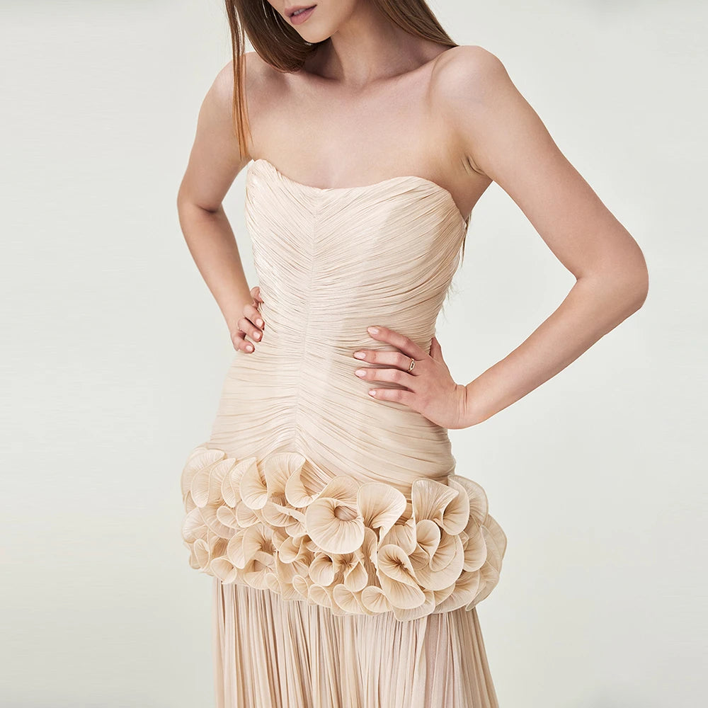 Side angle of woman in Teresa ruffled dress showing ruffle flow