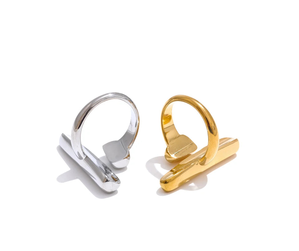 Gold and silver ring stands on a white background