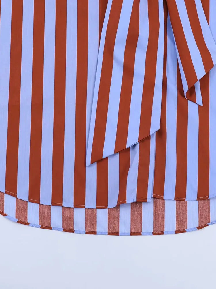 Close-up of a red and white striped fabric with a blue background