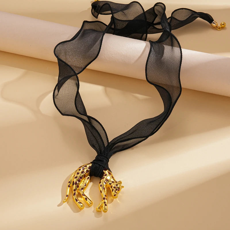 Leopard Pendant Necklace — necklaces in gold lace detail — close-up detail