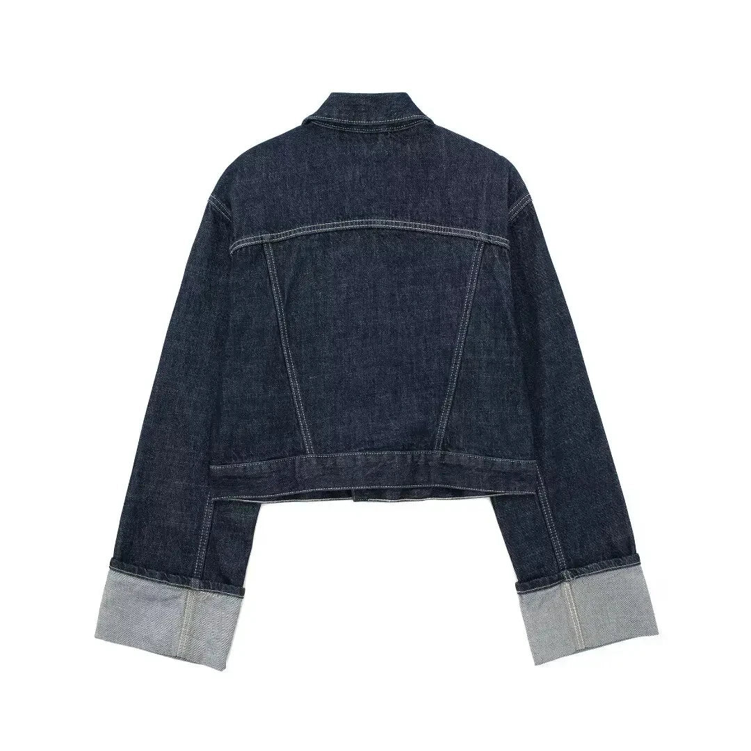 Back view of a dark blue denim jacket on a white background