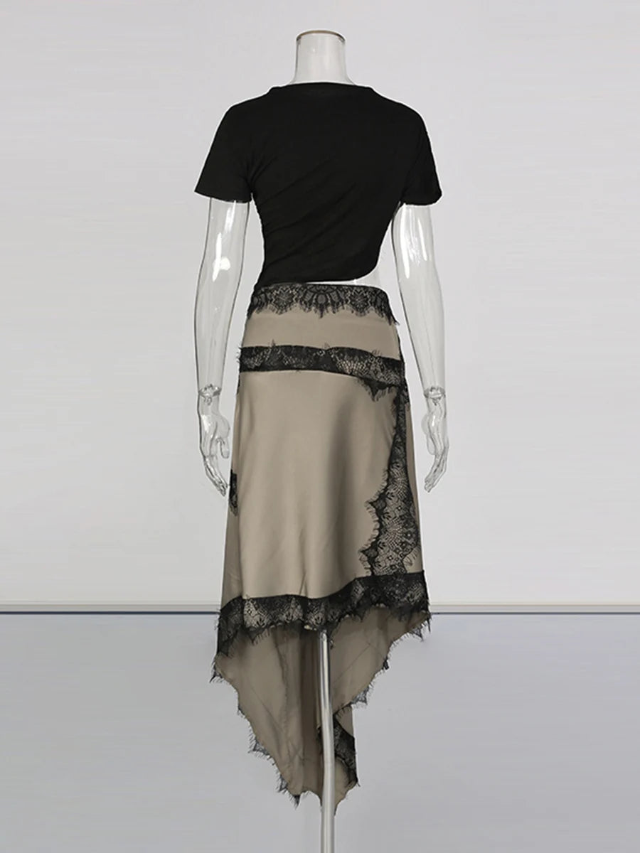 Mannequin wearing a black top and beige skirt with lace details on a white background