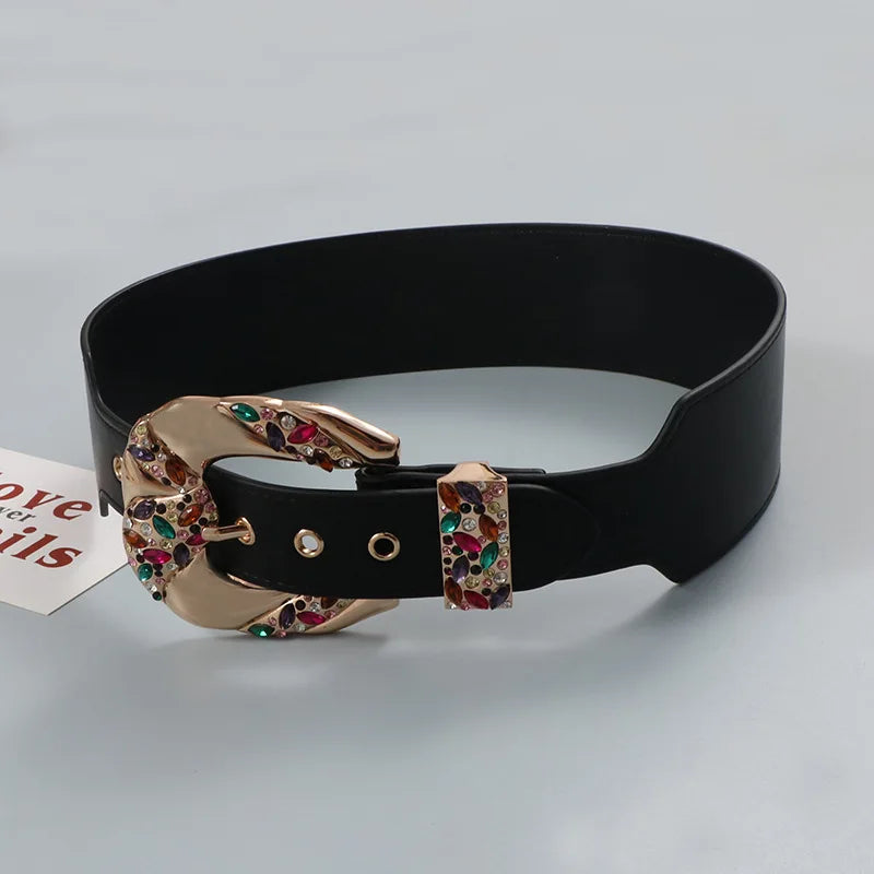 Black belt with a colorful buckle on a light gray background