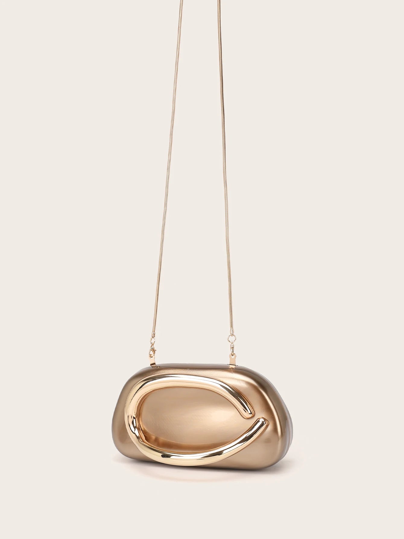 Woman styling metal handle clutch bag for evening occasions