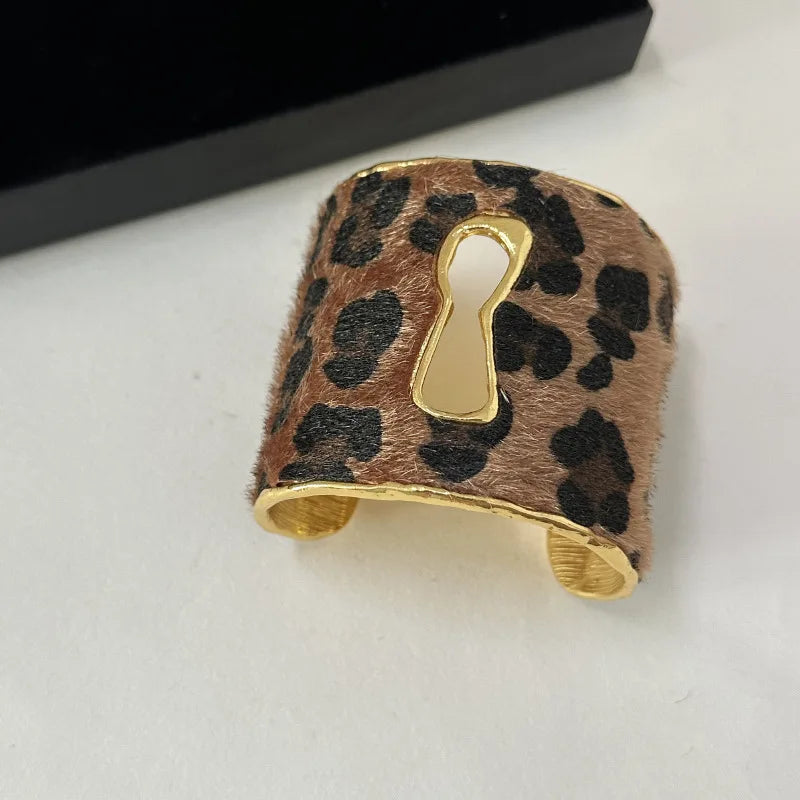 Keyhole Open Cuff Bracelet — bracelets in gold — close-up detail